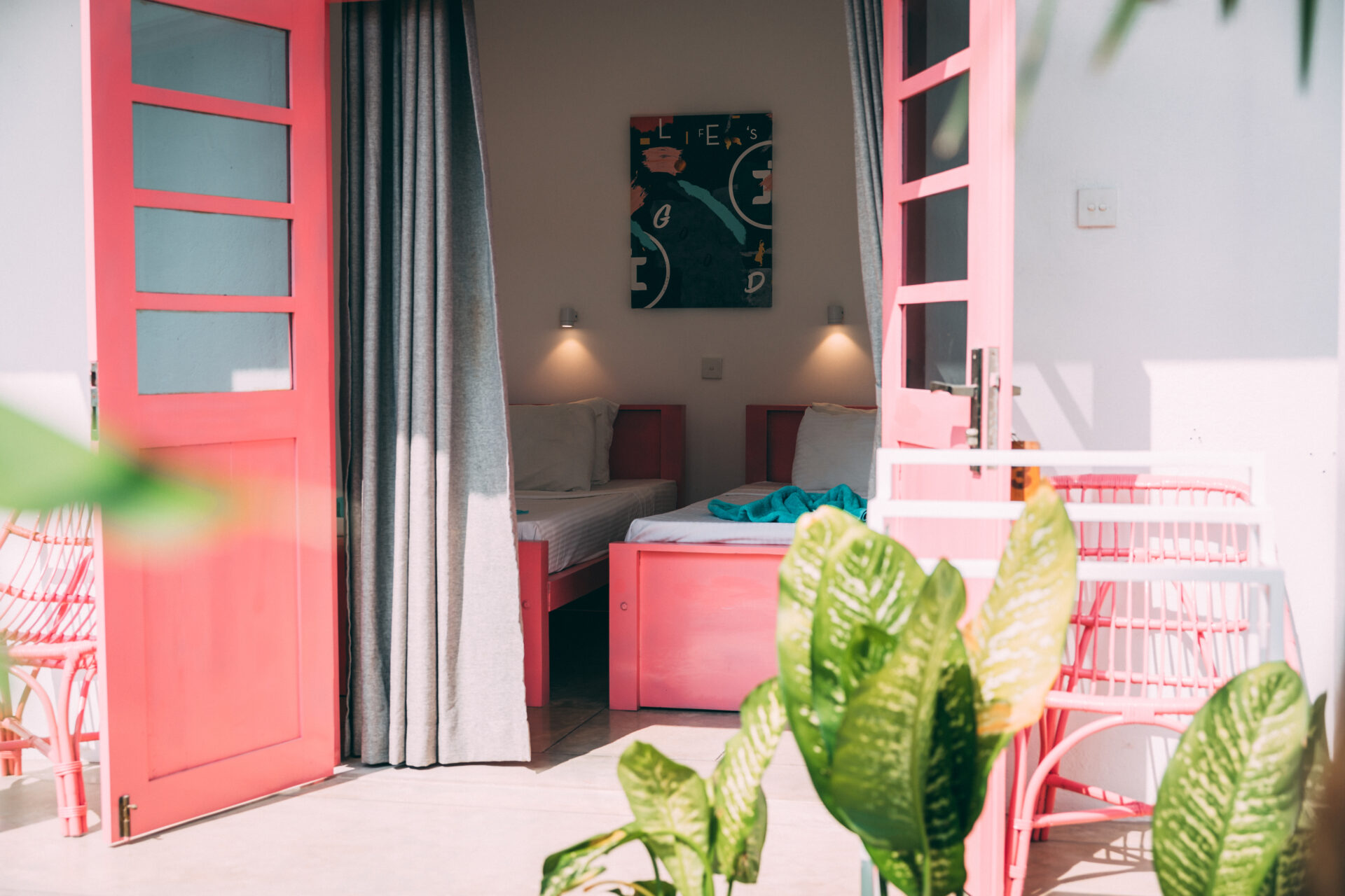 an open door with a bedroom inside. Surf accomodation, Sri Lanka